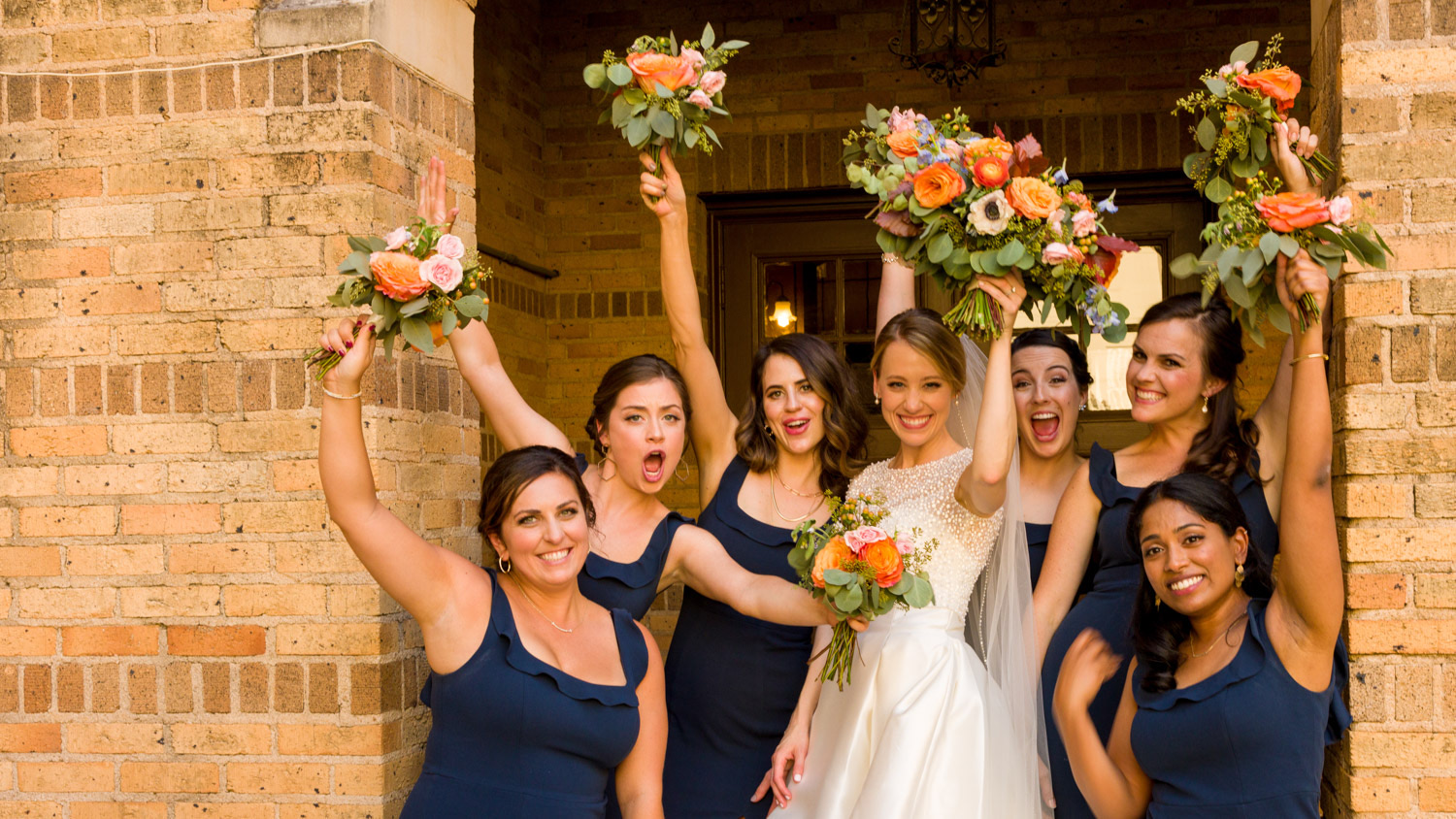 Hannah and her bridesmaids celebrating after the ceremony