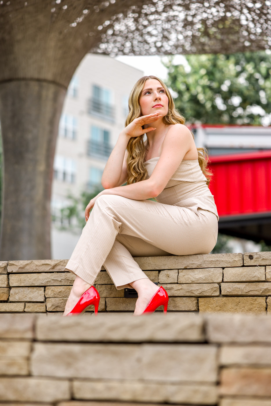 Brynley crossing the street, Vogue-style senior portrait at The Domain