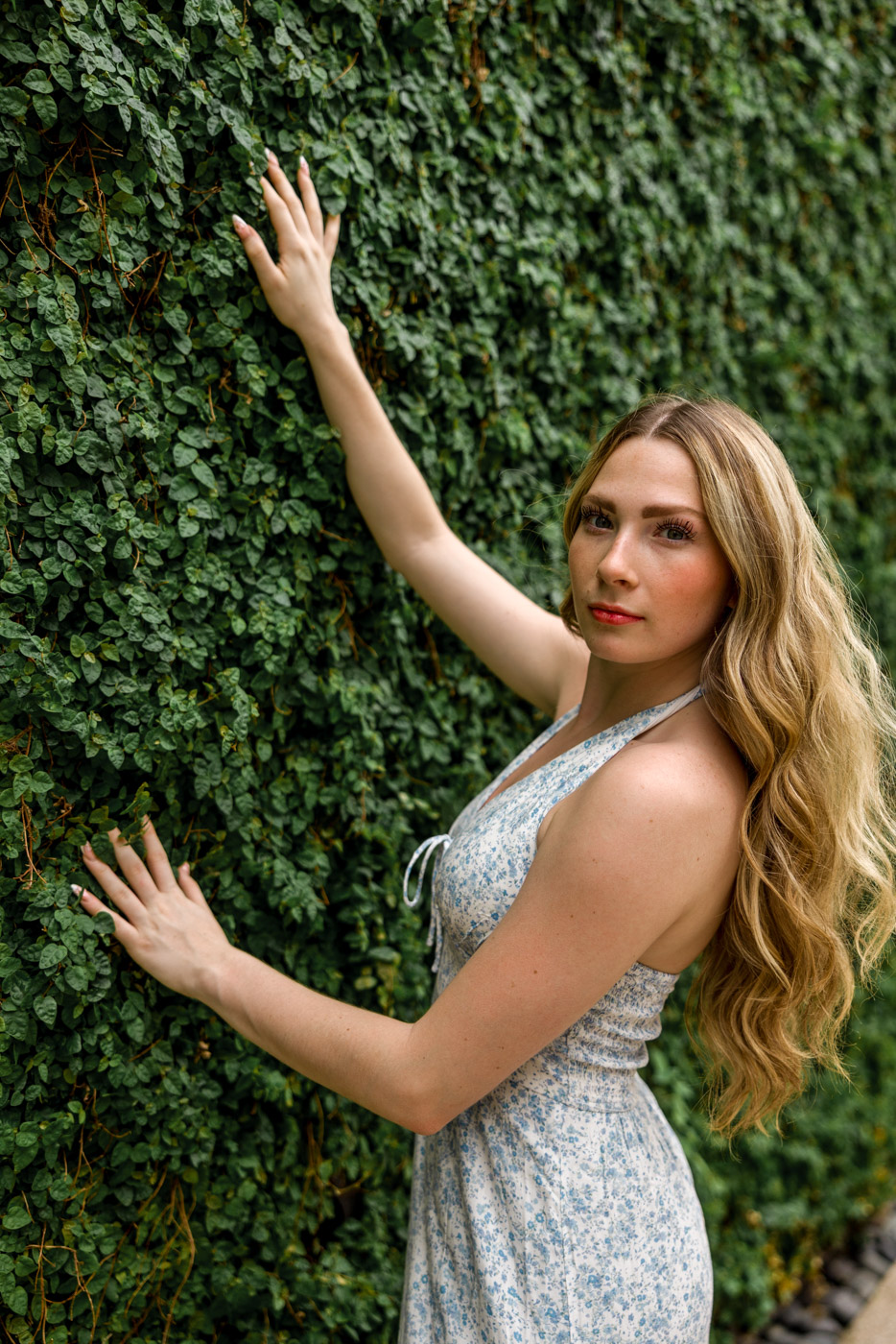 Editorial senior portrait, green wall, Austin